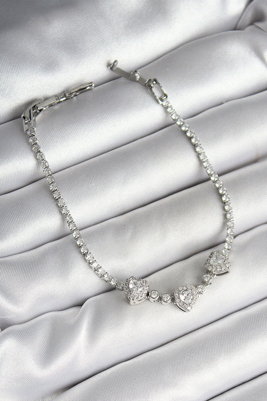 Pirinç Sıralı Kalp Figürlü Zirkon Taşlı Gümüş Renk Kadın Bileklik