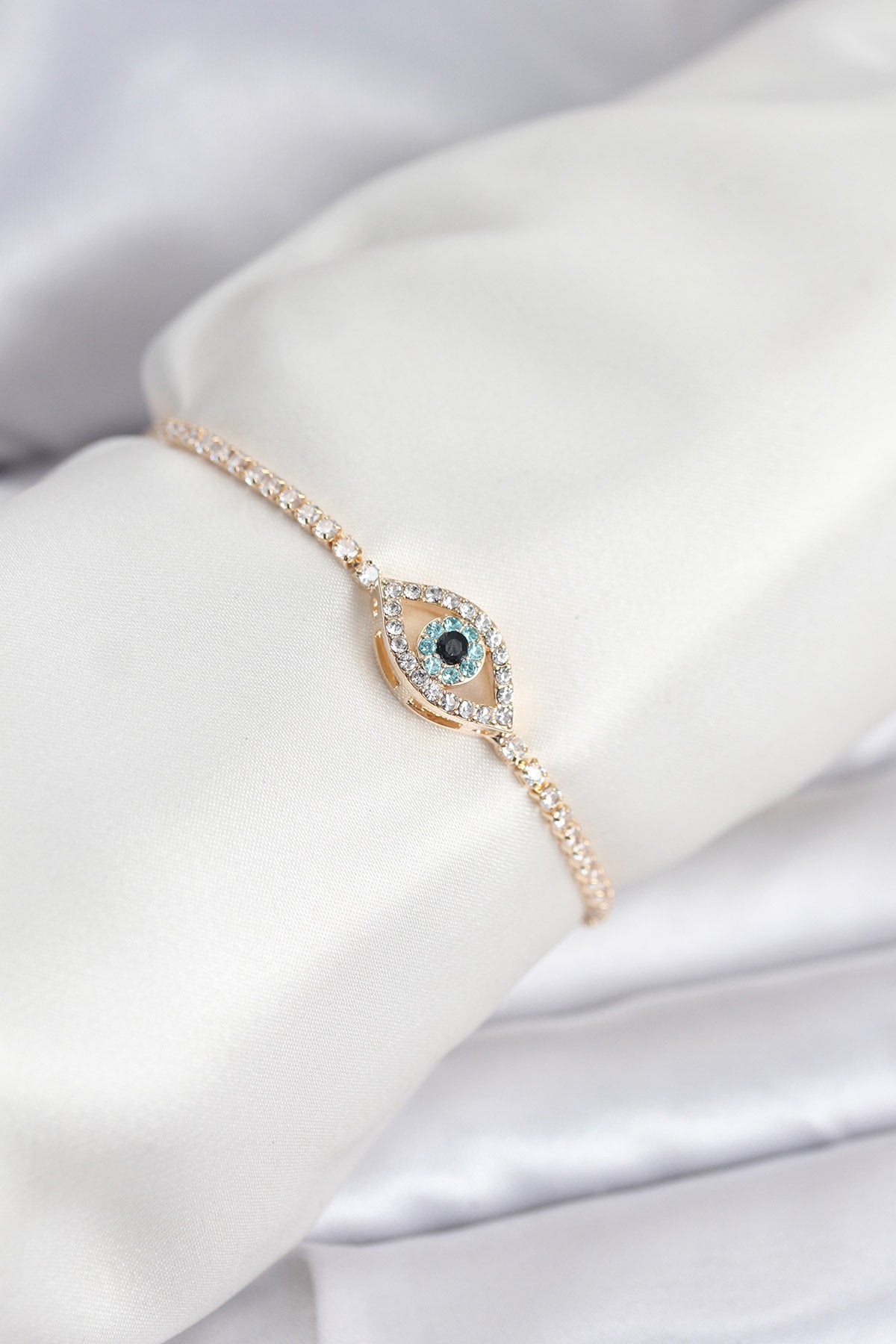 Gold-Tone Adjustable Eye Motif Tennis Bracelet with Zircon Detail